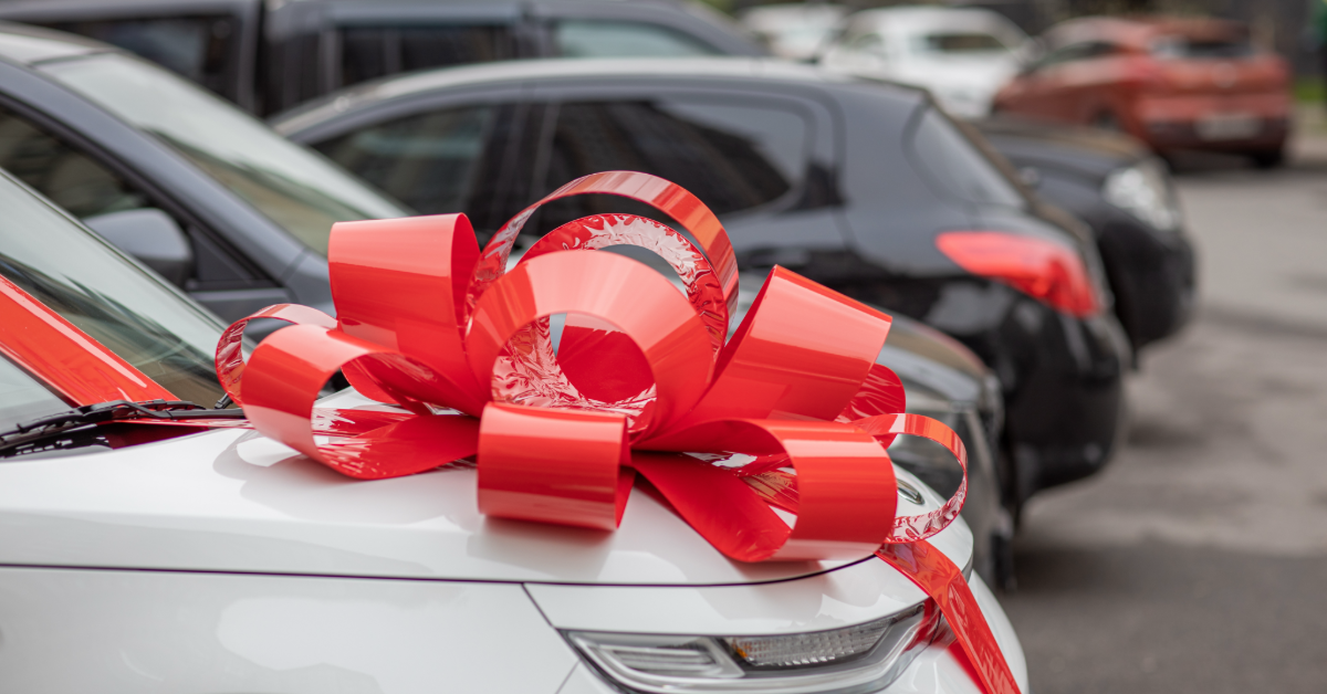 white car with red bow