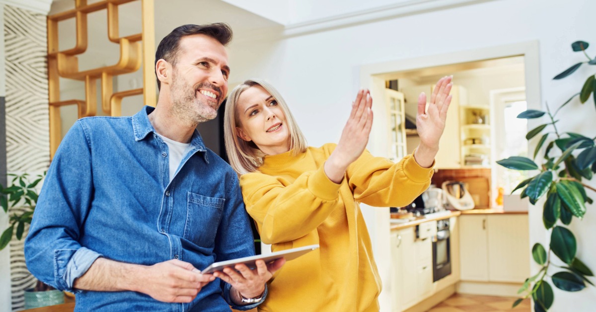 Middle aged couple discussing home improvements using an mit fcu heloc