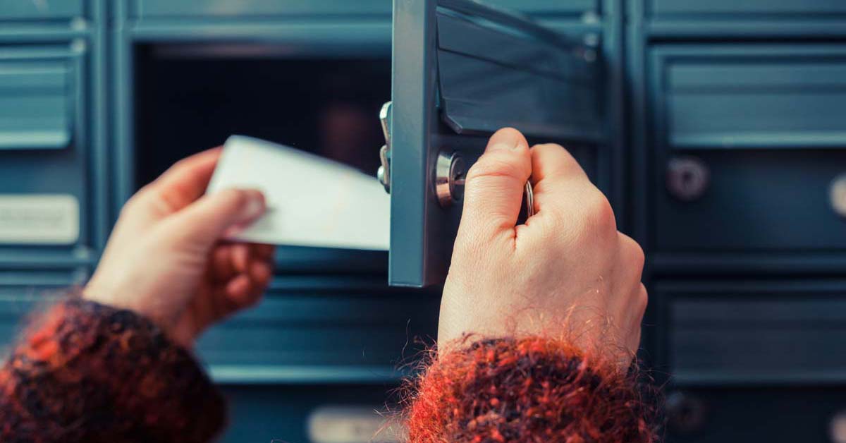 Person taking mail out of mailbox 