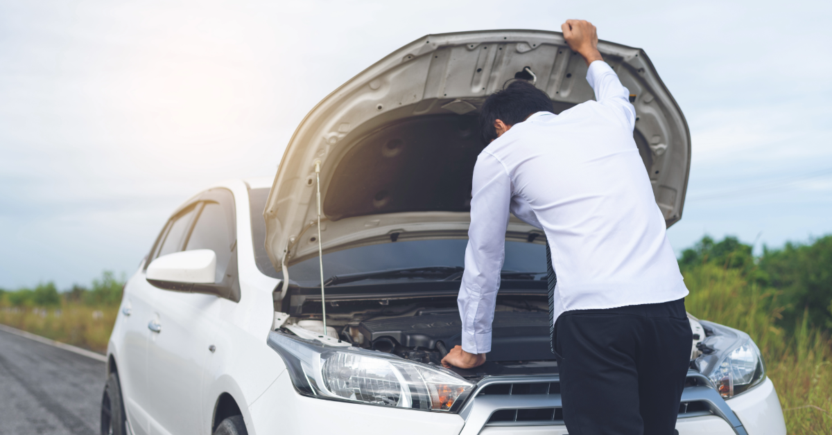 Man with a broken down car