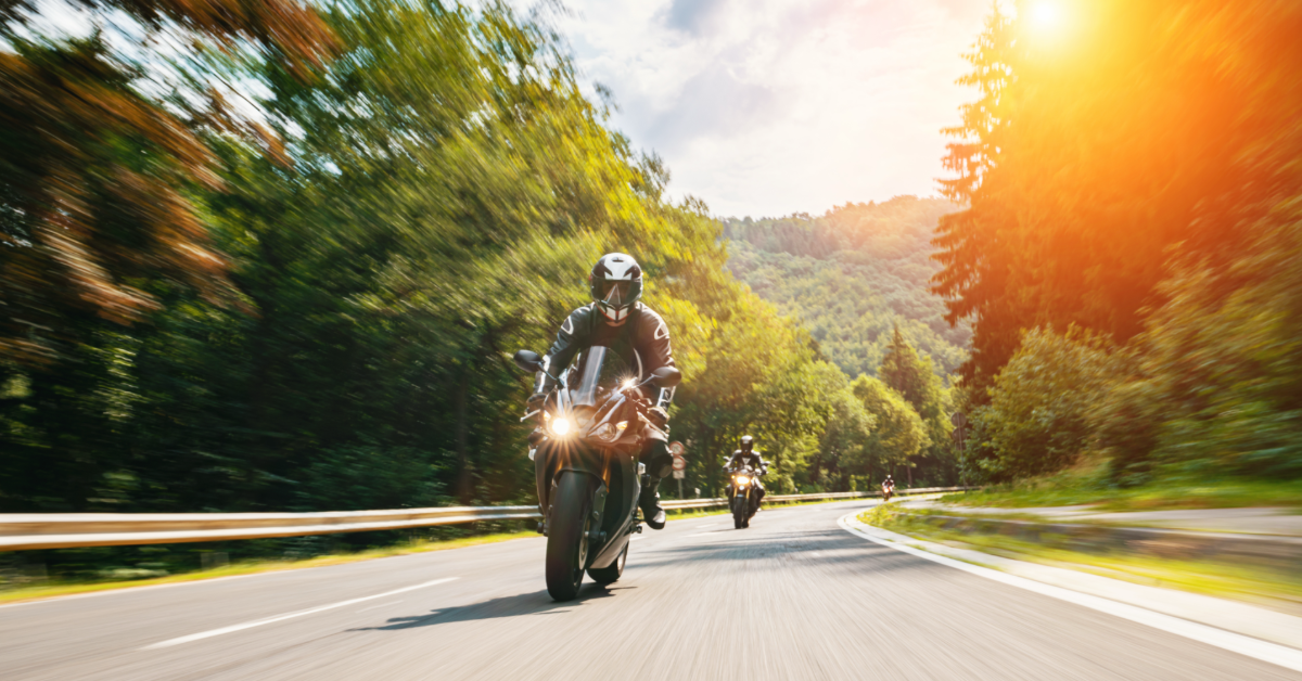 Two people riding motorcycles